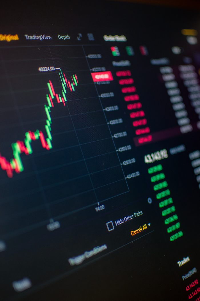 Close-up of a digital screen showing cryptocurrency market trading graph and data.