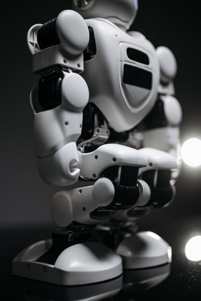 Close-up view of a modern robotic figure in monochrome, showcasing innovative technology.